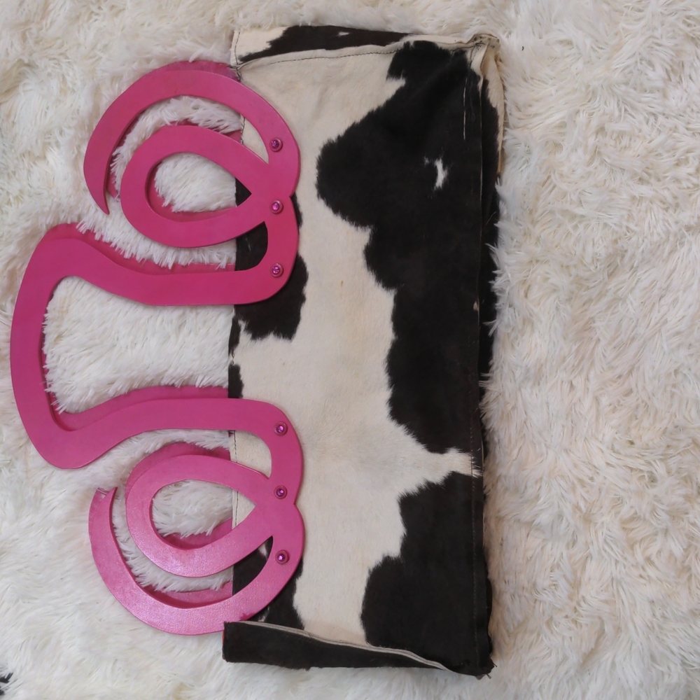 Unusual cowhide purse with pink swirly wooden handles